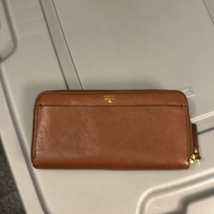 Genuine tan leather with matching wallet .